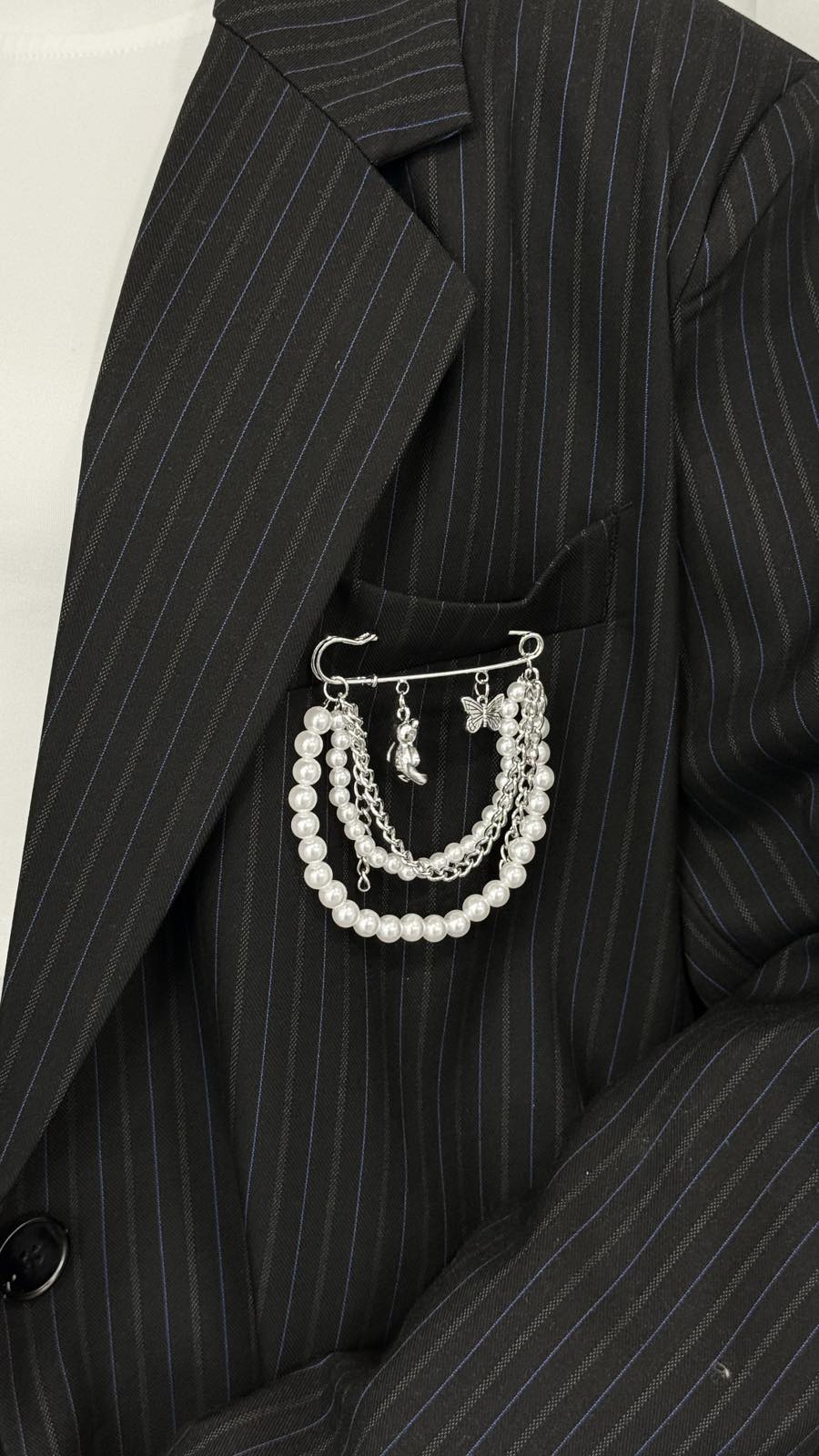 Pin with chains