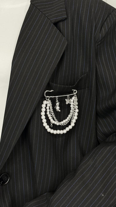 Pin with chains