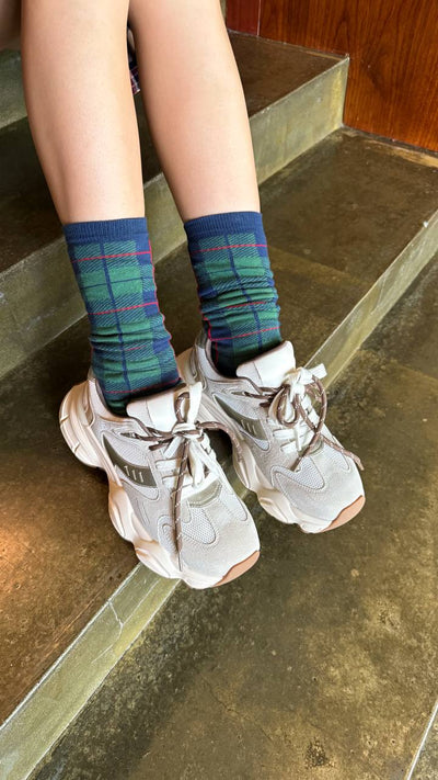 Plaid golfs Green